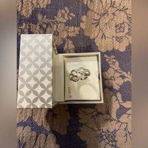 Pure silver plated ring with white stones. New in box. Size 8.